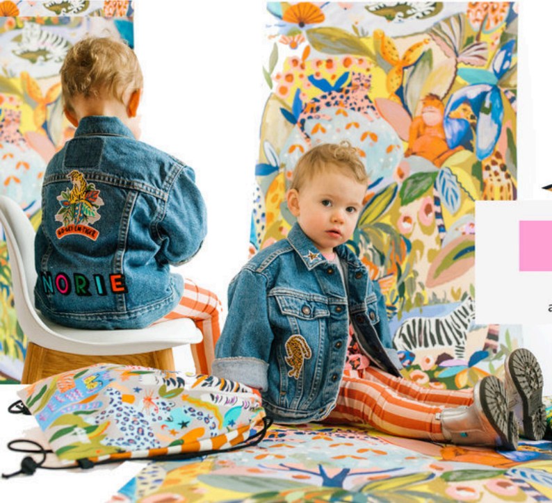 Eleanor Bowmer x Patchy Tiger: child wearing embroidered denim in a colourful illustrated setting