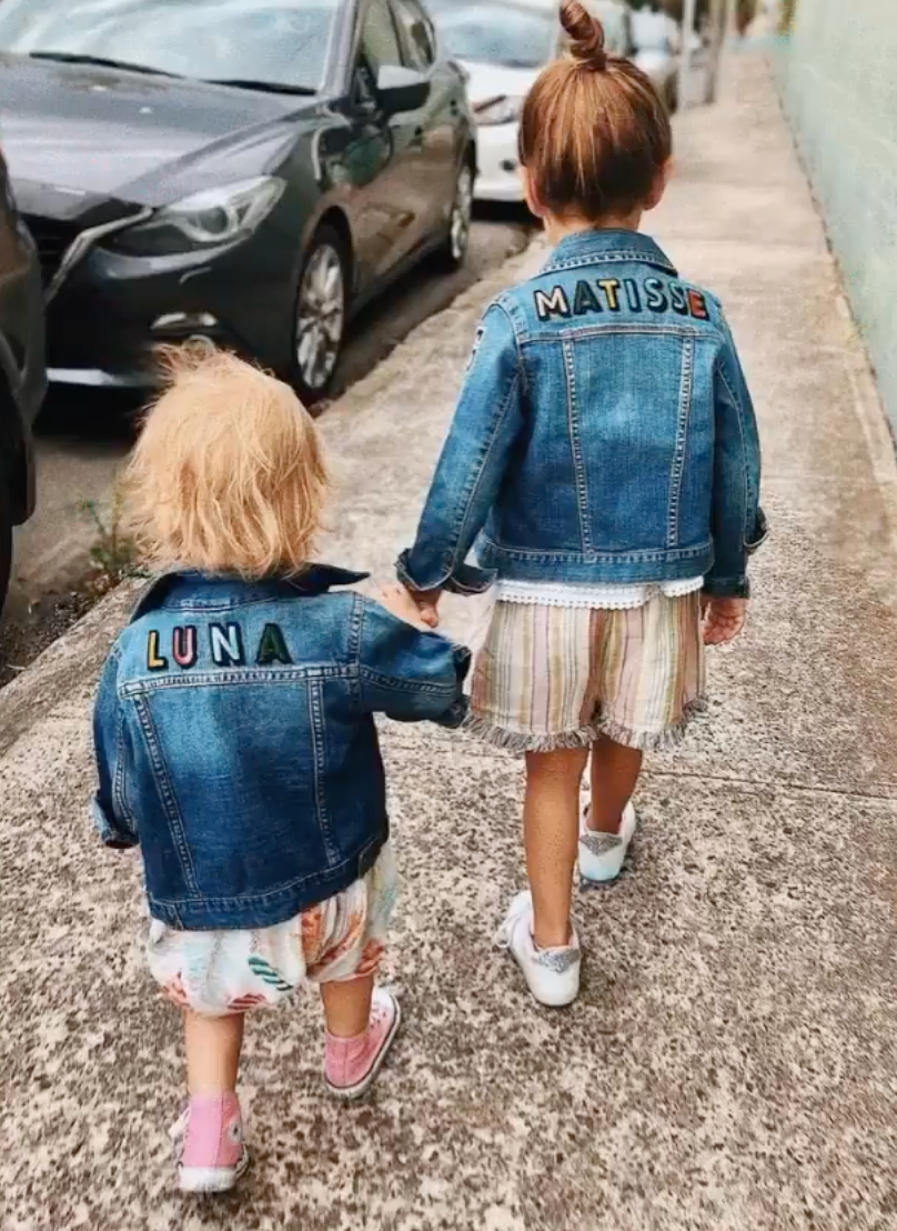 Luna and Matisse walking together in personalised Patchy Tiger denim jackets