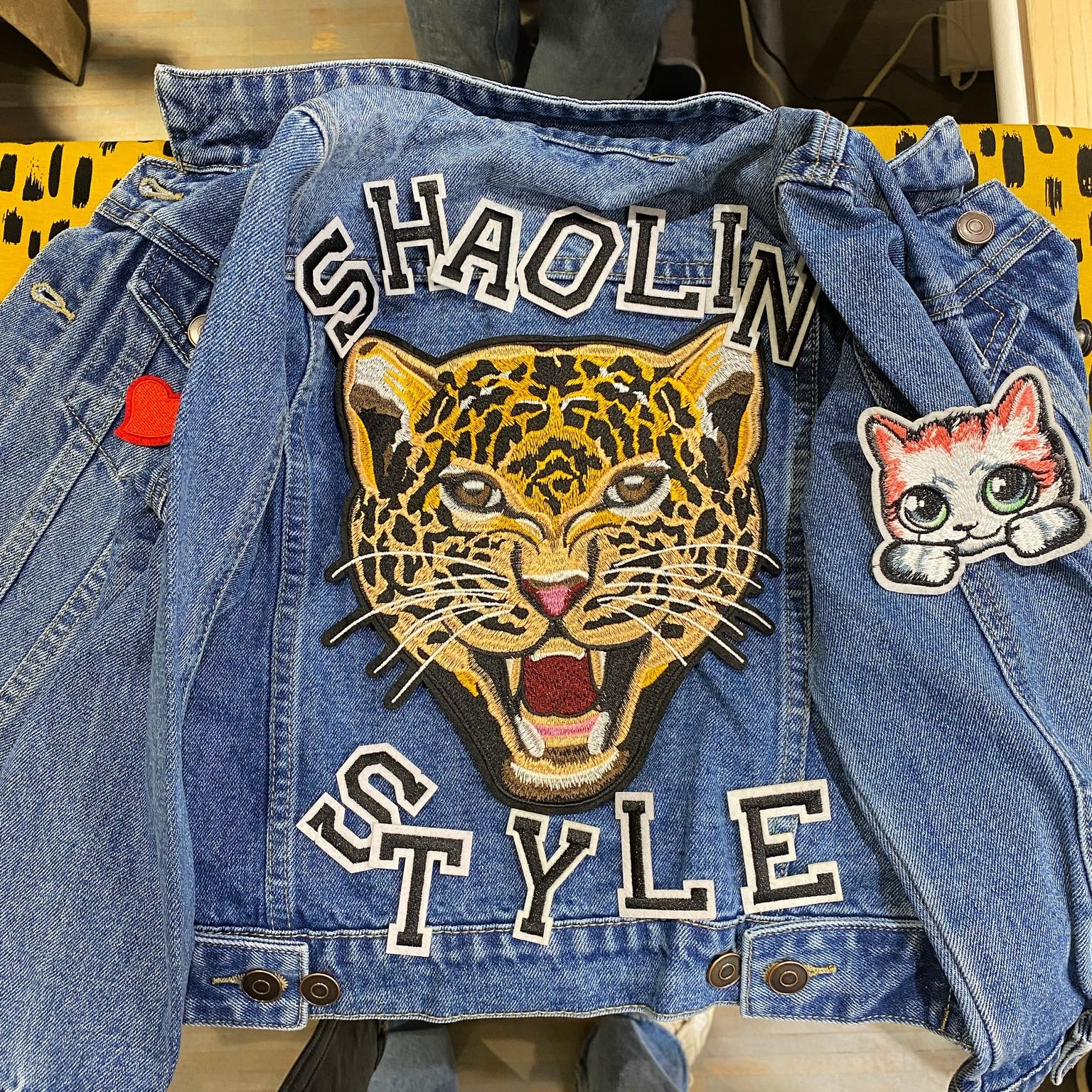 Personalised denim jacket with a large leopard patch